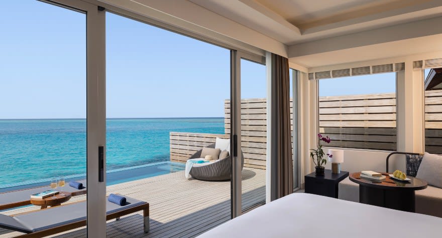 Avani Over Water Pool Villa Bedroom at Avani+ Fares Maldives Resort