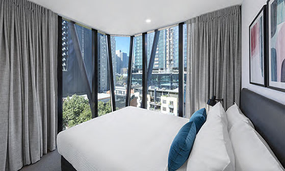 Queen size bed in 2 Bedroom hotel apartment with best views of Melbourne City