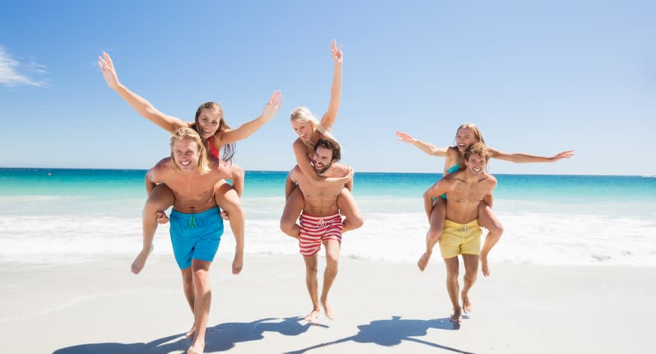 A group of friends enjoying their summer beach holiday at Avani+ Fares Maldives Resort
