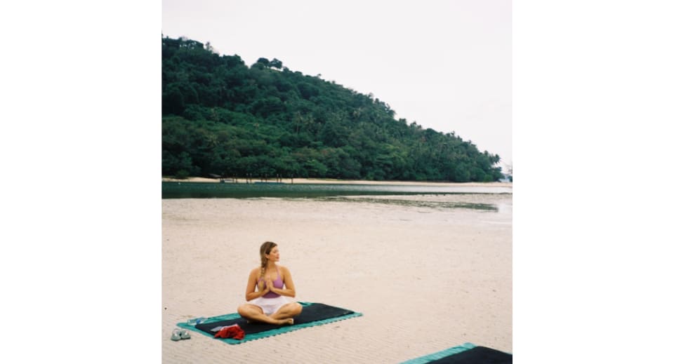 Morning yoga by the bay in front of the villa at Avani+ Samui Resort