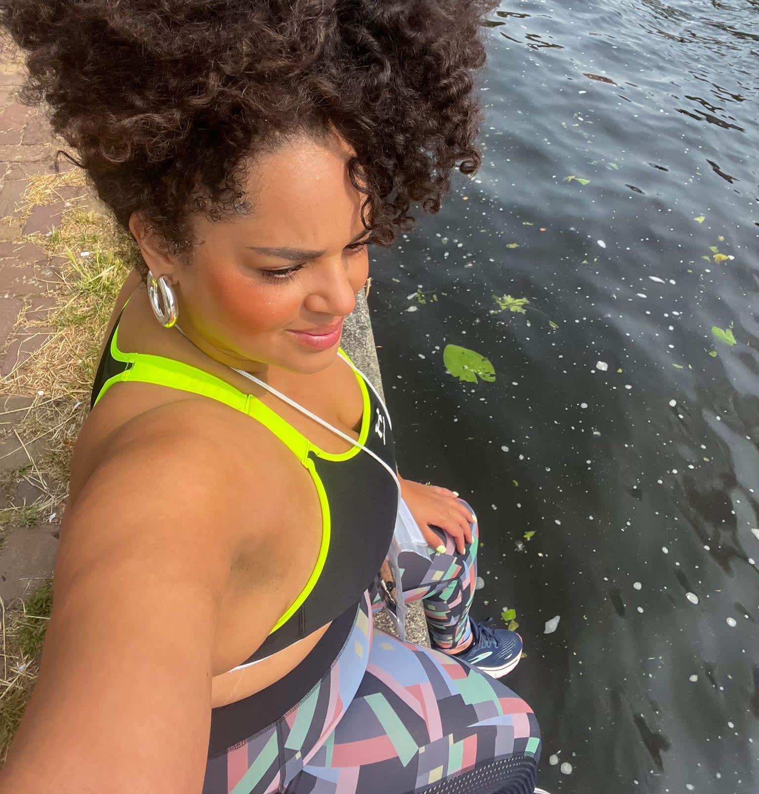 Laura Bartlett sitting beside the canals during her SUP session