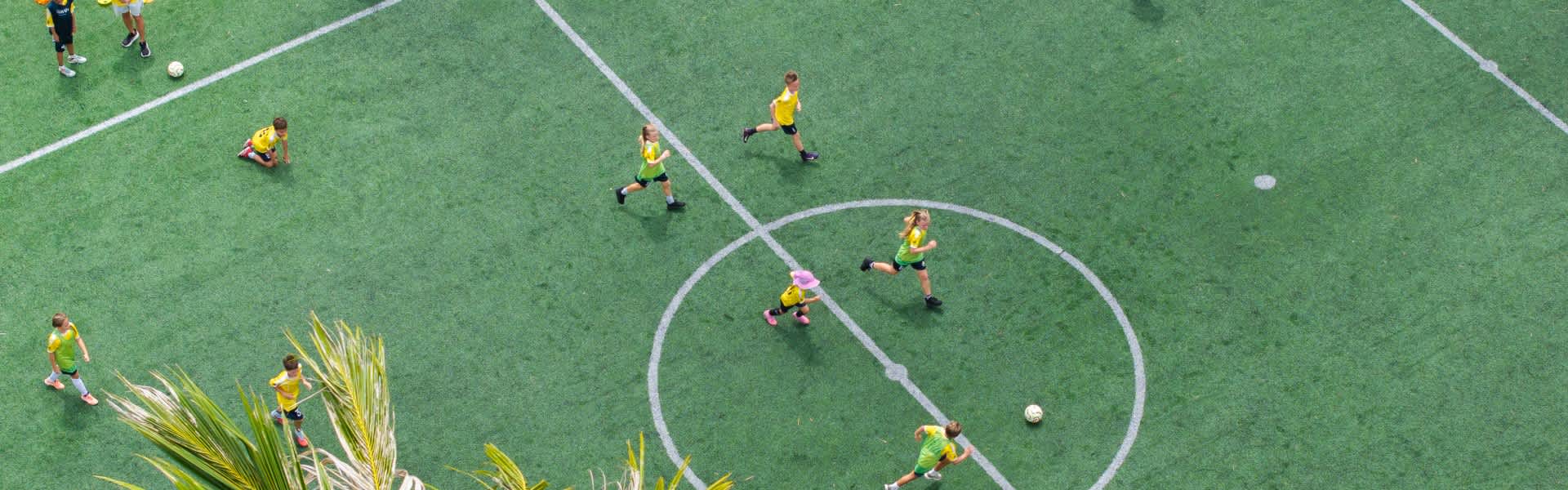 Aerial view of the football pitch at Avani+ Fares Maldives Resort