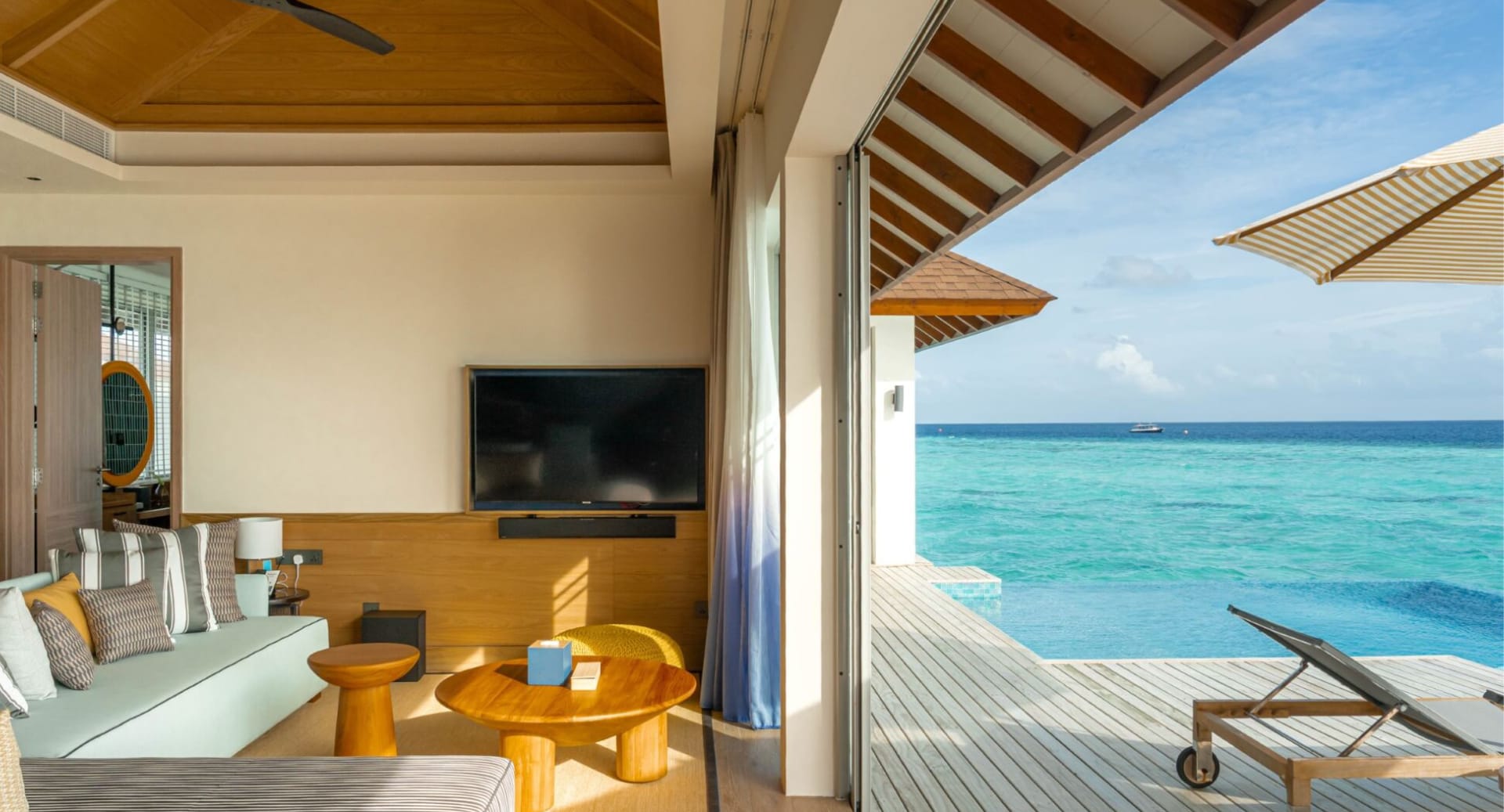 Oceanview villa living room with private pool and terrace at Avani+ Fares Maldives Resort