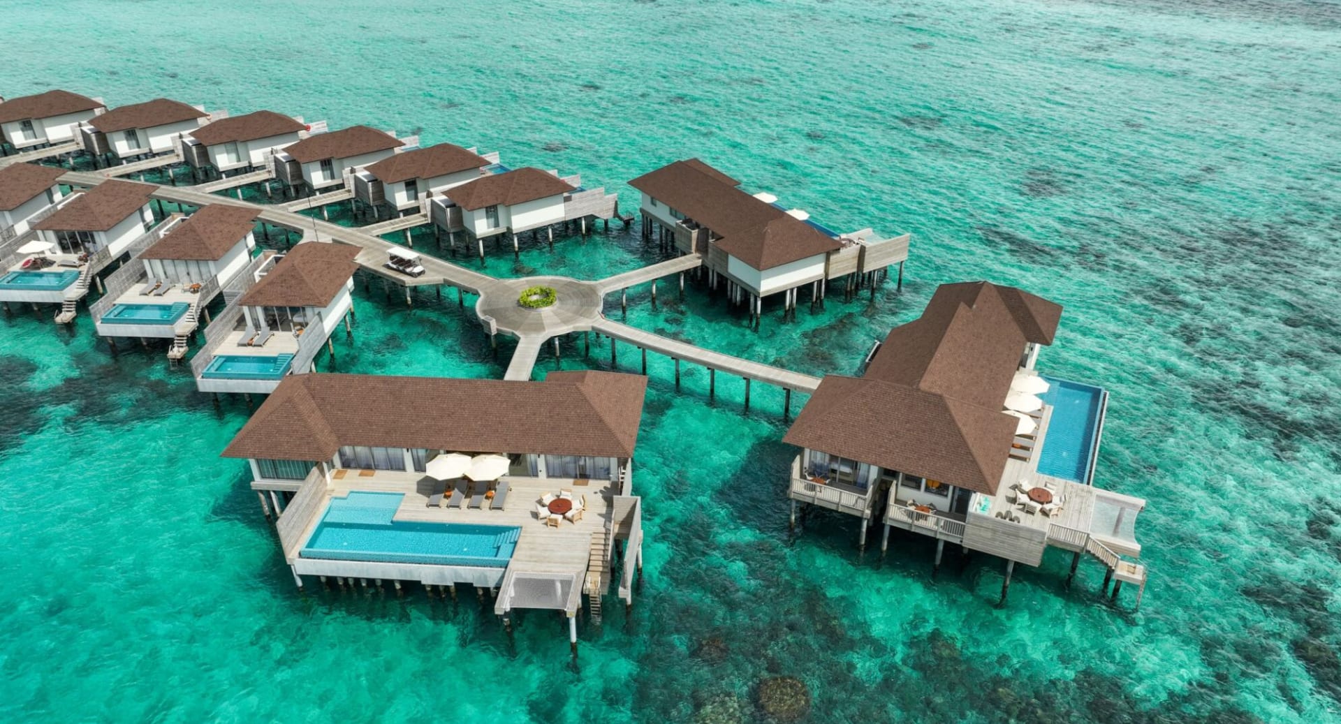 Aerial view of overwater residence with private pools at Avani+ Fares Maldives.