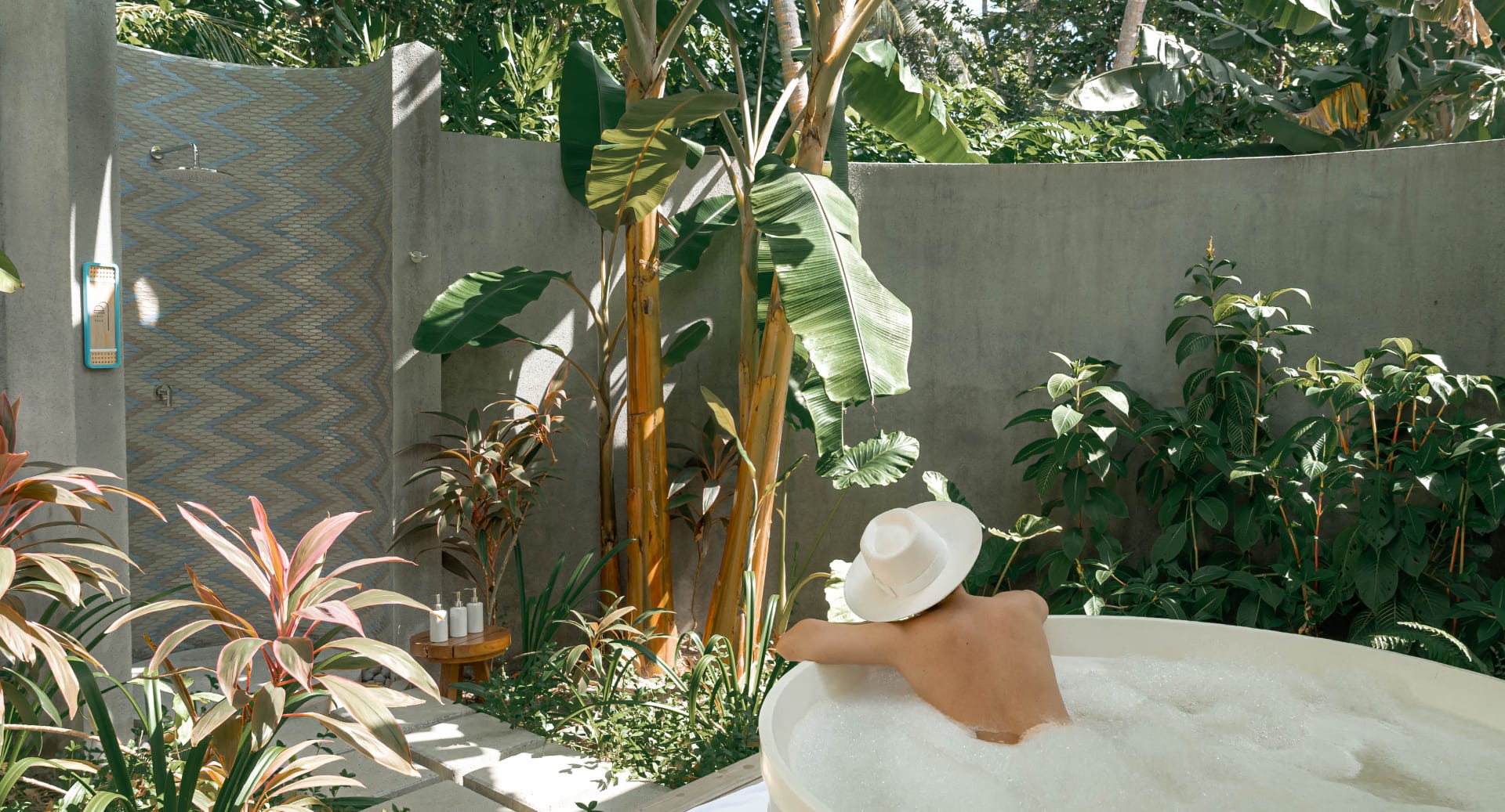 Luxury spa treatment room with outdoor shower at Avani+ Fares Maldives resort