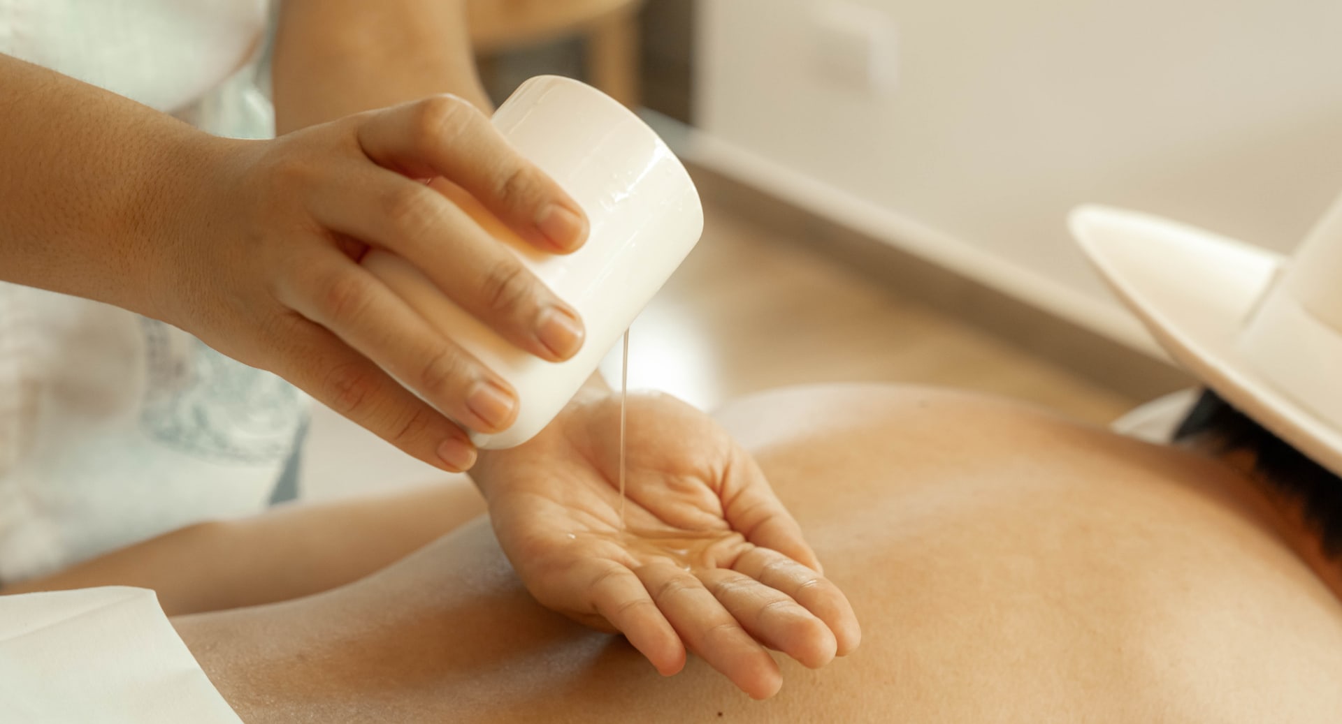 Relaxing oil massage treatment at Avani+ Fares Maldives resort spa