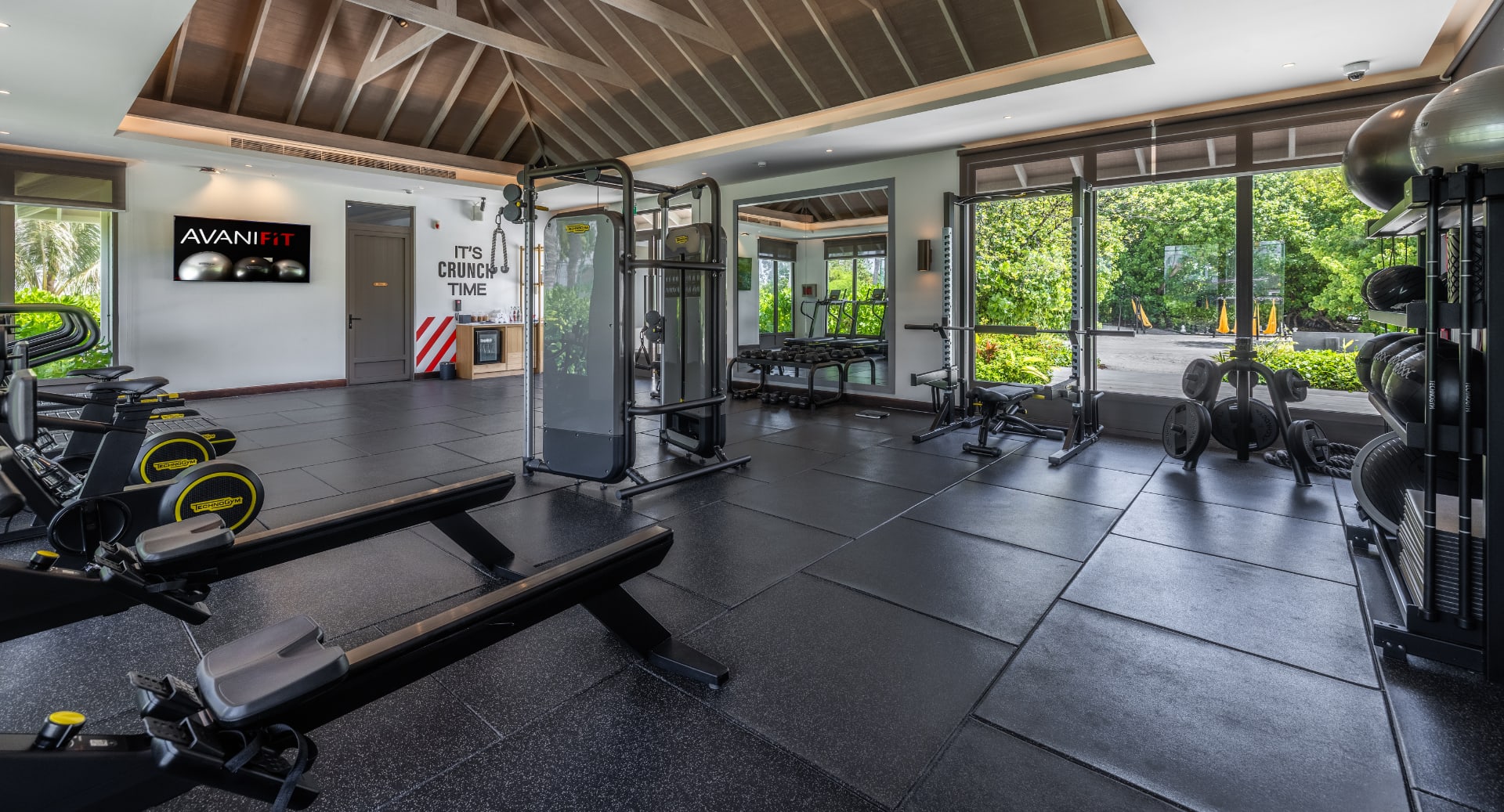 Workout area with strength and cardio equipment at Avani+ Fares Maldives
