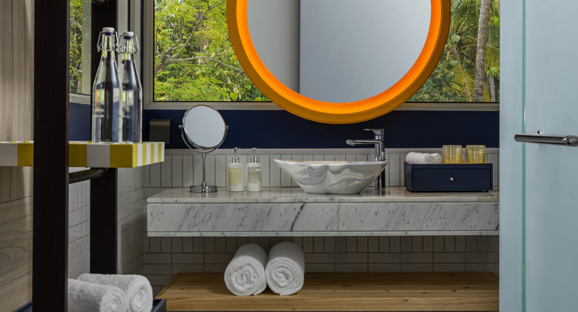 Luxury bathroom with natural lighting and amenities at Avani+ Fares Maldives island resort