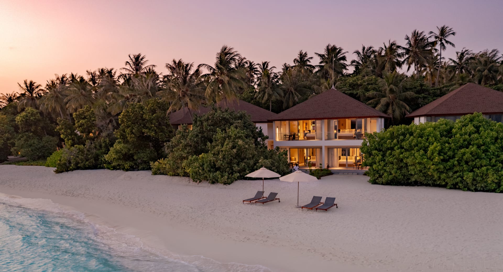 beachfront pavilion at sunset at Avani+ Fares Maldives Resort