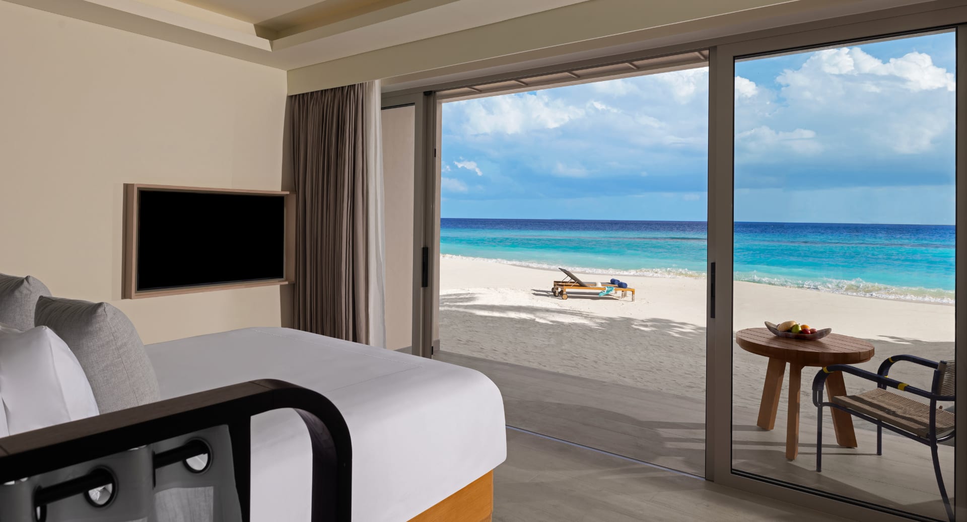 beachfront pavilion with terrace and sea view at Avani+ Fares Maldives island resort