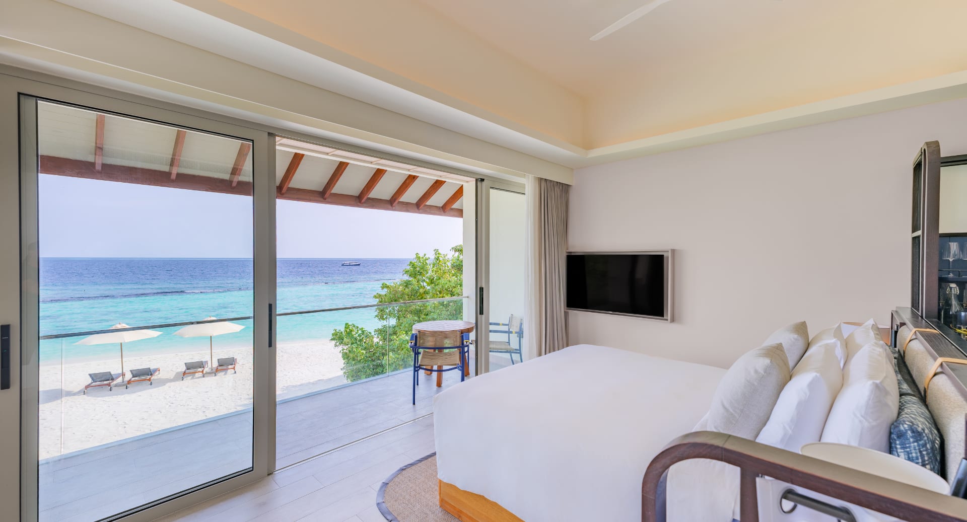 Beachfront pavilion with modern design and oceanfront terrace at Avani+ Fares Maldives island resort