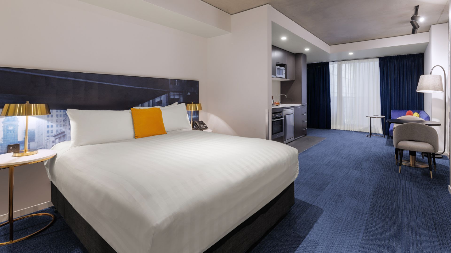 Standard Studio room at Avani Melbourne Jazz Corner Residences featuring a comfortable bed and elegant interior