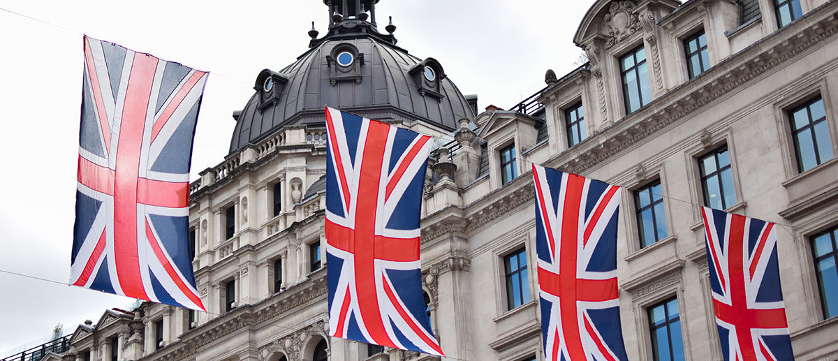 Flying UK flag before the building