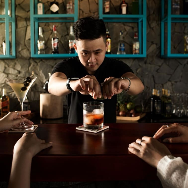A bartender pouring a drink at Gio.