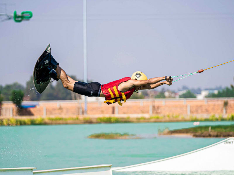 Man performing a wakeboard trick at ICF Wakepark in Siem Reap