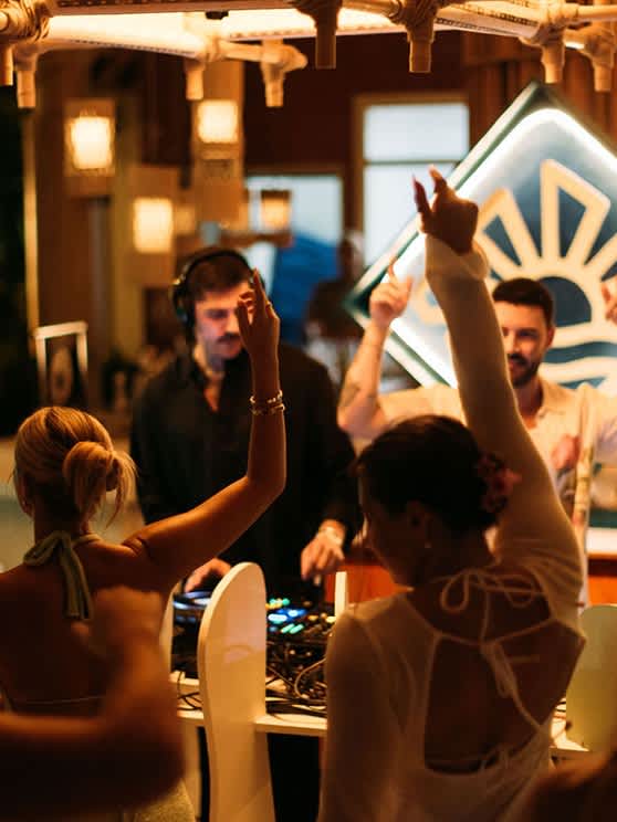 Crowd dancing at the Your Paradise Music Festival, at the Baa Atoll's best lifestyle resort, Avani+ Fares Maldives Resort