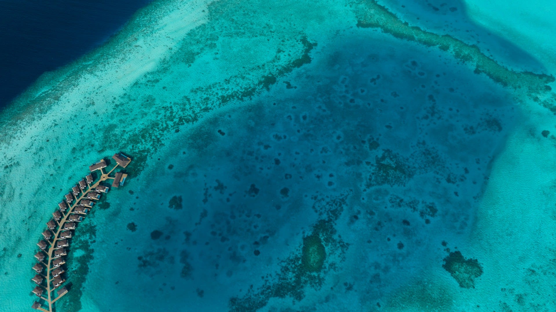 Aerial view of Over Water Villas at Avani+ Fares Maldives Resort