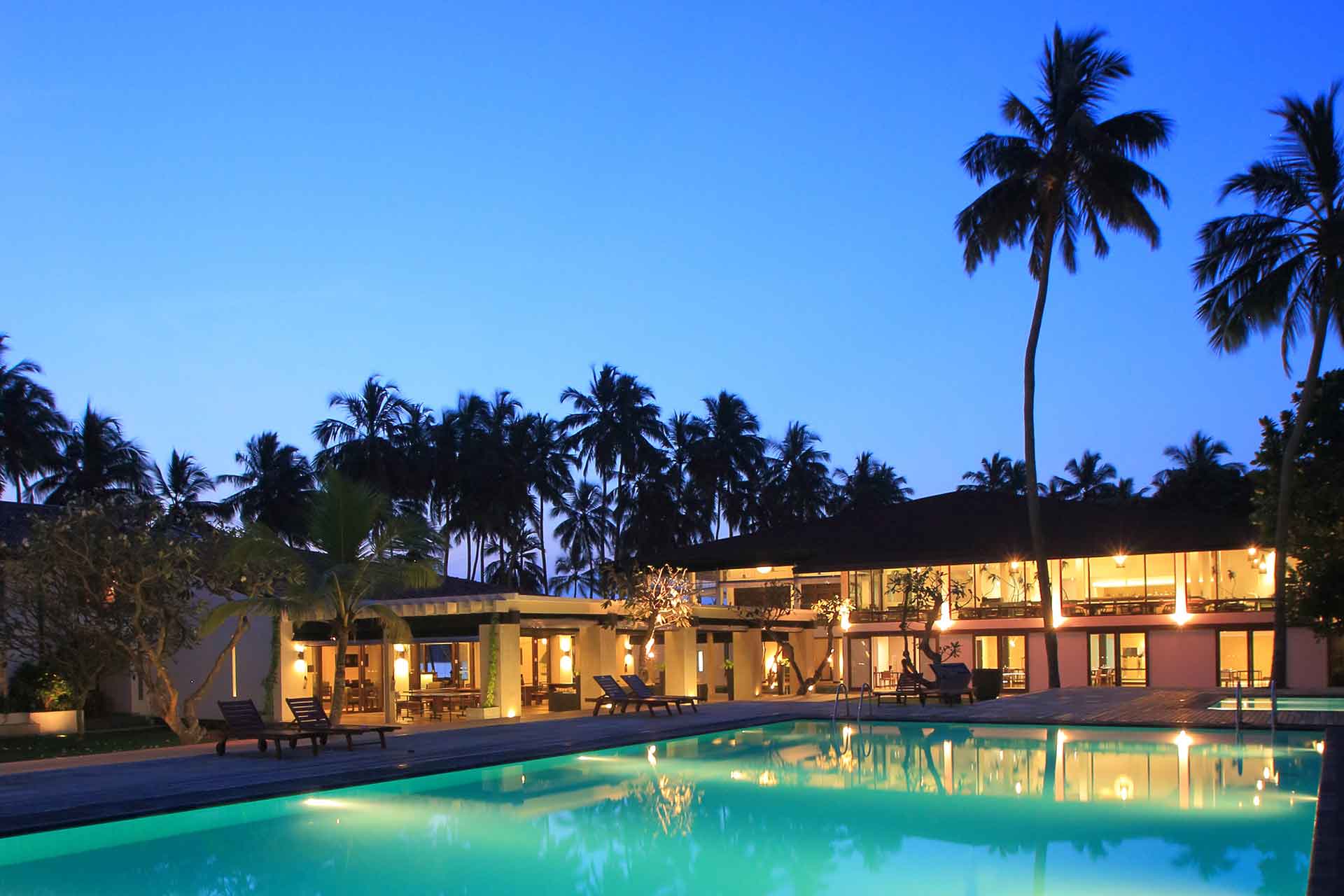 View of the AVANI Kalutara Resort pool at night
