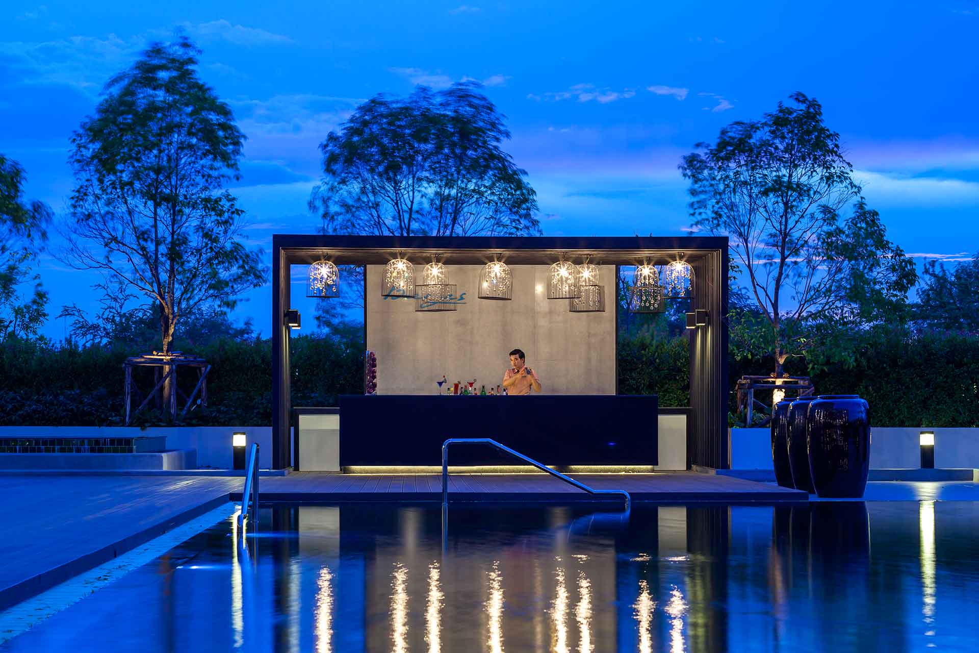 The breeze bar by pool at dusk