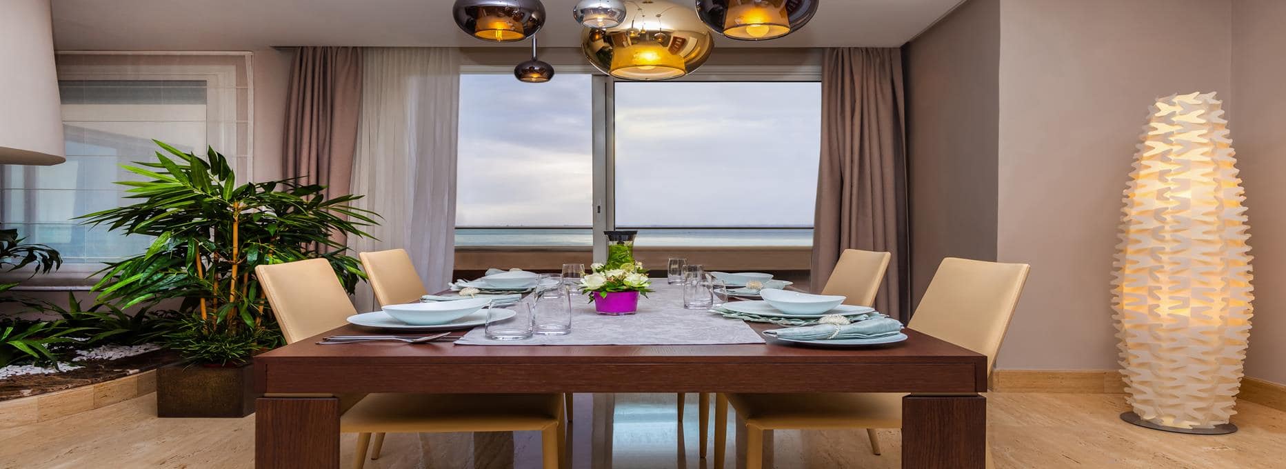 Avani Four Bedroom Lake View Loft Suite Dining Table at Avani Les Berges du Lac Tunis Suites