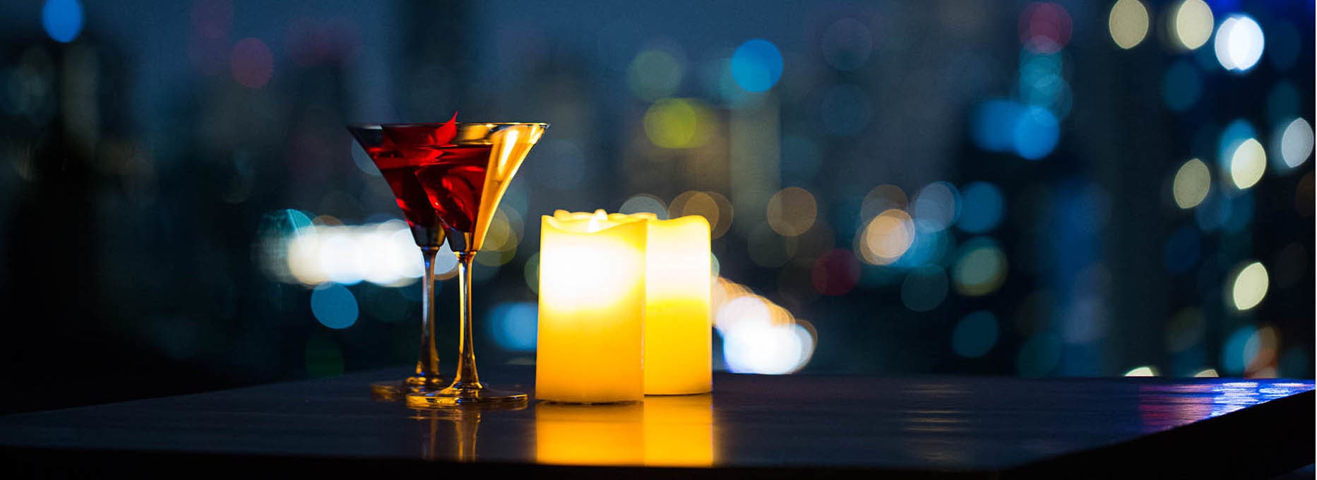 Cocktails and candles on a table